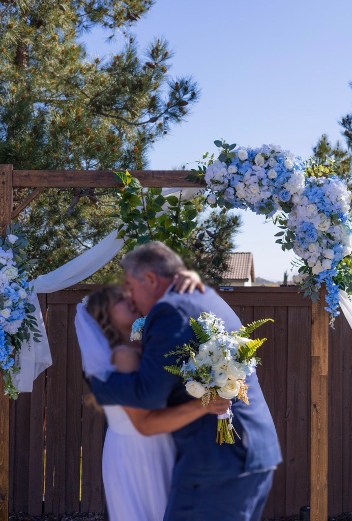 Floral ceremony arch at golden hour